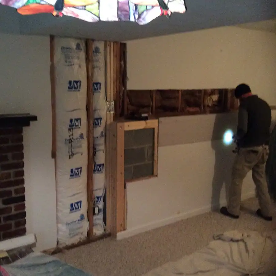 Restoration technician inspecting water damage in Tavares